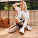 Young female tennis player relax after match - PhotoDune Item for Sale