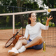 Young female tennis player relax after match - PhotoDune Item for Sale