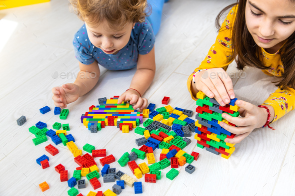 The child plays as a constructor. Selective focus. - Stock Photo - Images