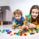 The child plays as a constructor. Selective focus. - PhotoDune Item for Sale