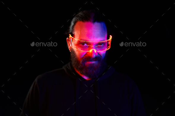 Portrait of a caucasian cool man with a futuristic extended reality goggles