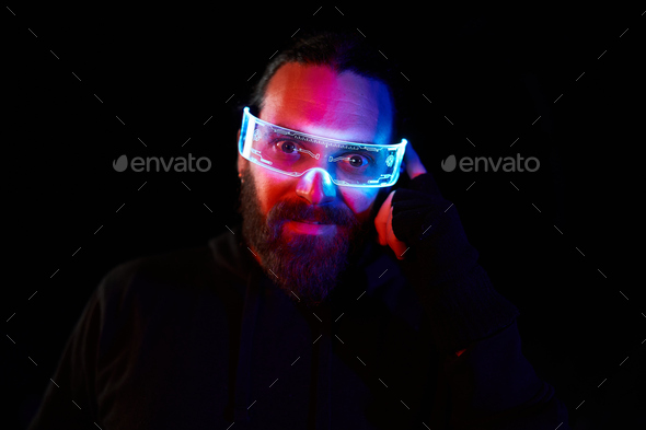 Portrait of a pensive man using a extended reality goggles