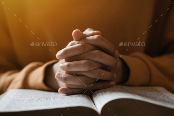 girl praying thanksgiving with holy scriptures God's teachings based on faith and faith in God