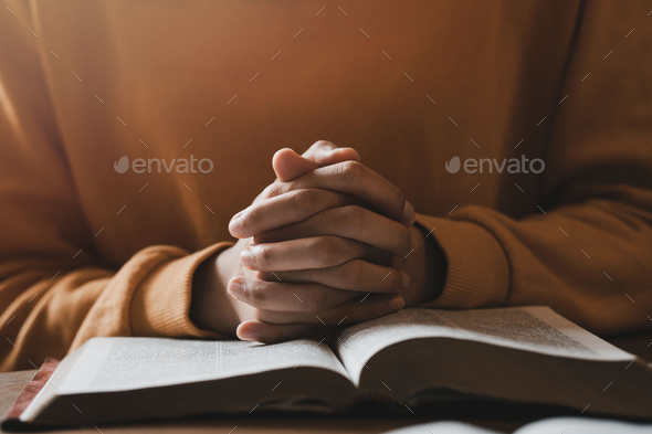 girl praying thanksgiving with holy scriptures God's teachings based on faith and faith