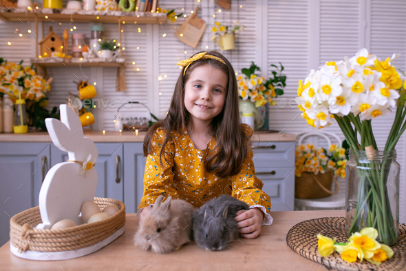 Girl with two rabbits - Stock Photo - Images