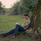 Calm farmer reading book sunset rural nature. Relaxed man enjoying at olive tree - PhotoDune Item for Sale