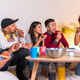 friends on sofa eating pizza and drinking soda at home party, eating pizza and telling funny stories - PhotoDune Item for Sale