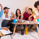friends on a sofa eating pizza and drinking soft drinks at a home party, portrait with pizza - PhotoDune Item for Sale