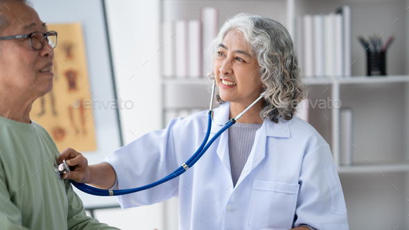 Mature Asian Female Doctor Use Phonendoscope Examine Mature Male Patient Heart Rate At