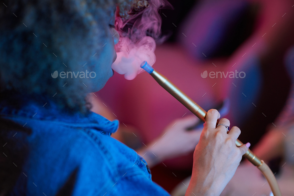 Young Woman Smoking Hookah - Stock Photo - Images