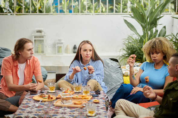 Young People Eating Together - Stock Photo - Images