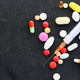 syringe and pills on dark background, close up  - PhotoDune Item for Sale