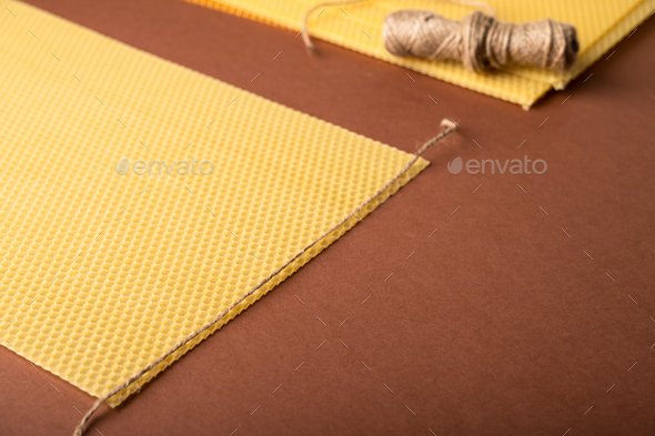 Beeswax honeycomb sheet ready to use on brown background - Stock Photo - Images