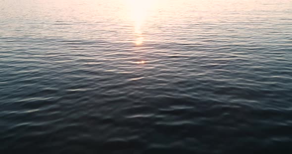 Video flight over ocean, sea on sunrise. Close to the water alt