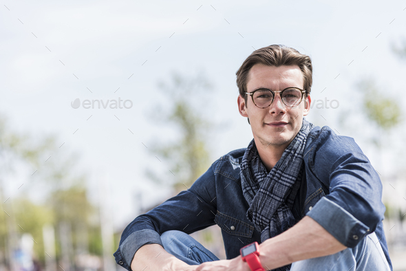 Portrait of confident young man outdoors - Stock Photo - Images