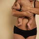 Unrecognizable woman in underwear holding a toddler - PhotoDune Item for Sale