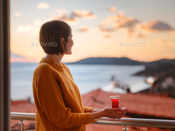 Woman drinking turkish tea from traditional turkish teacup - Stock Photo - Images