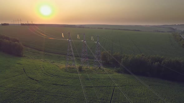 Transmission line in rural field. High-voltage tower, Stock Footage