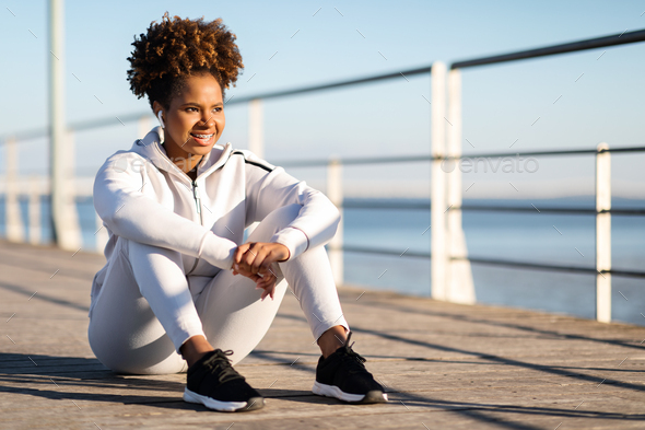 Portrait Of Beautiful Black Woman In Sportswear Relaxing After Training Outdoors - Stock Photo - Images