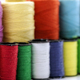 Reels or spools of multicolored sewing threads. Threads of all colors. - PhotoDune Item for Sale