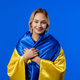 Blonde woman with national Ukrainian flag on blue. Ukraine, patriot, victory - PhotoDune Item for Sale