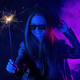 Stylish woman in eyewear dancing with bengal sparkler fire under neon light. - PhotoDune Item for Sale