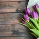 Beautiful bouquet of purple tulips on wooden table.  - PhotoDune Item for Sale