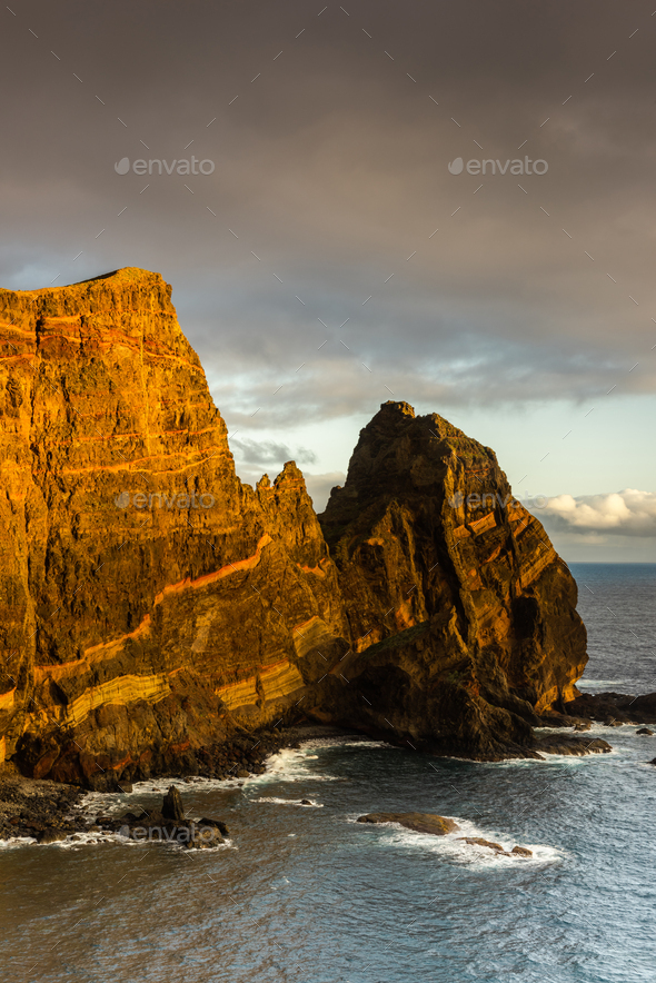 Volcanic cliffs at Atlantic Ocean in Madeira Island, Portugal - Stock Photo - Images