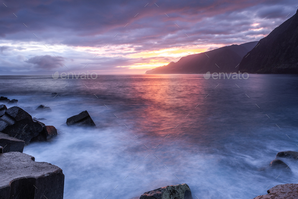 Beautiful sunrise over Madeira Seixal beach. Cliffs and rocks and atlantic ocean  - Stock Photo - Images