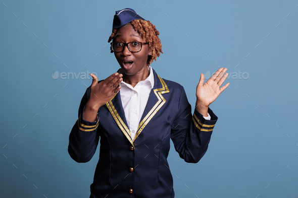 Female flight attendant excited to hear good news - Stock Photo - Images