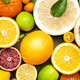 Citrus fruit food background, top view. Mix of different whole and sliced fruits - PhotoDune Item for Sale