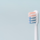 Toothbrush in profile against blue background - PhotoDune Item for Sale