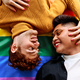 Gay couple lying on a lgtb rainbow flag - PhotoDune Item for Sale