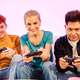 Friends playing console sitting in the soda at home - PhotoDune Item for Sale