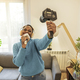 African american woman recording music tutorial with camera at home looking positive and happy  - PhotoDune Item for Sale