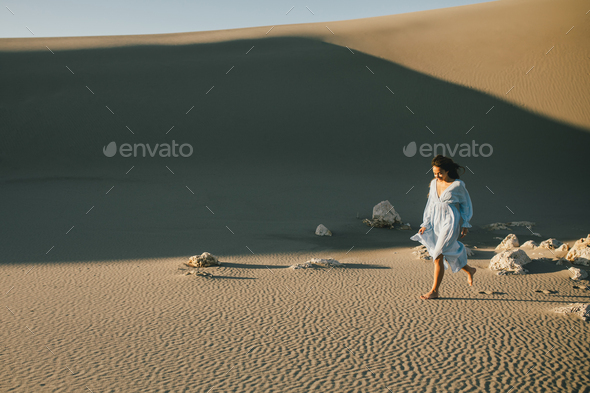 Woman With Long Hair In A Stylish Dress Poses In The Desert Sandsturkey  High-Res Stock Photo - Getty Images