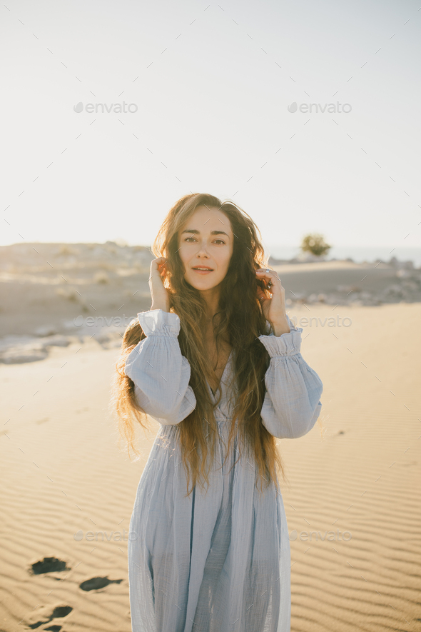 Fit lady performing yoga pose in sandy terrain - a Royalty Free Stock Photo  from Photocase