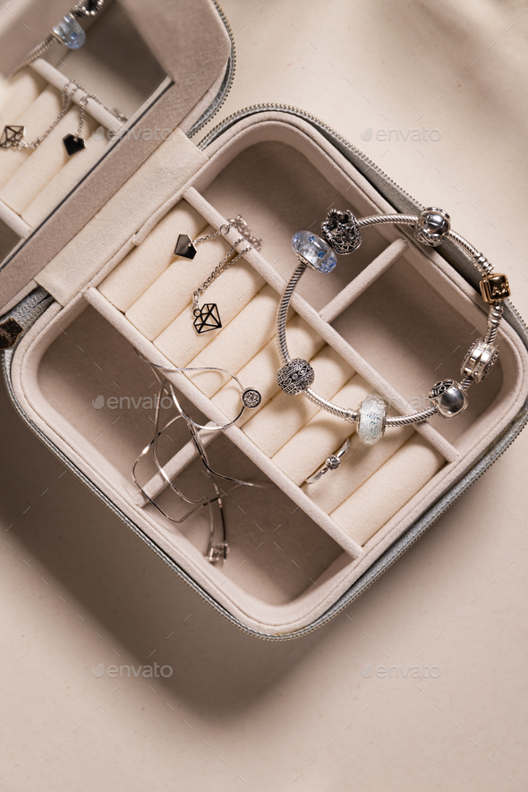  Jewelry box with white gold, silver and diamonds. Top view. - Stock Photo - Images