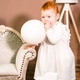 Little redhead baby girl wih balloon celebrates first birthday anniversary. 1 year family party  - PhotoDune Item for Sale