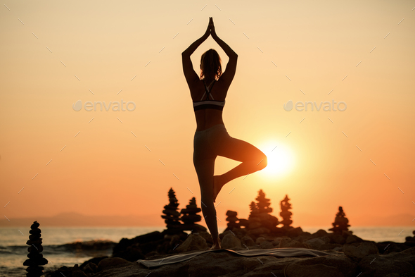 Silhouette Woman Practicing Yoga At Beach During Sunset Tree Asana Pose -  Stock Video | Motion Array