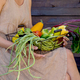 Eco-friendly concept with organic farm vegetables in the hands of a girl in a linen dress of natural - PhotoDune Item for Sale