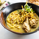 Khao soi is popular delicacy of the Northern Thailand made up of curry noodle with chicken - PhotoDune Item for Sale