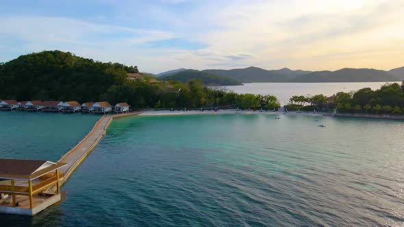 Island Beach Resort Sunlight Ecotourism Aerial Drone Fly Right alt