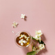 Cup of jasmine tea with jasmine flowers on a pink pastel background.   - PhotoDune Item for Sale