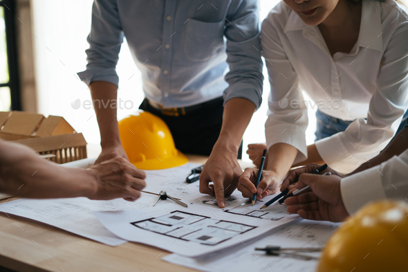 Engineer and Developers Gathered Around Finding Solution and Analysing Industrial Engine Design. Clo - Stock Photo - Images