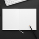 Top View of Blank Paper in Note Book Surrounded By Office Supplies On Gray Desk - PhotoDune Item for Sale