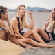 Three beautiful woman friends having fun on a beach - PhotoDune Item for Sale
