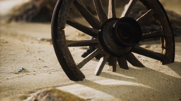 Large Wooden Wheel in the Sand alt