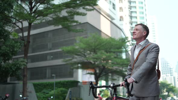 Businessman using smartphone for online business partner in city urban digital lifestyle technology. alt