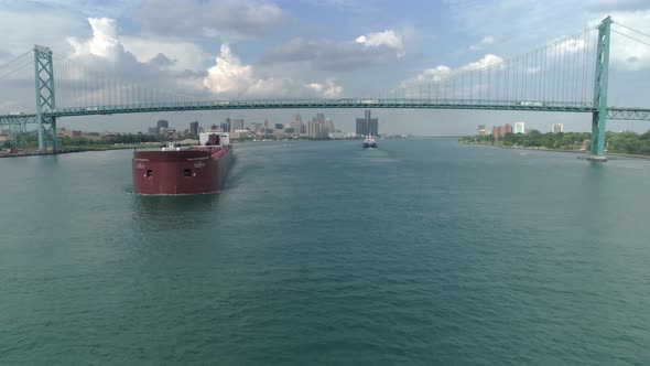 This video is of an aerial of large tanker ships in the Detroit river near downtown Detroit. alt